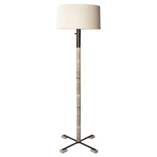  Honed stone column in rich grey and warm beige, accented with rich oiled bronze finished fittings. Four feet in the same beautiful stone. A light linen hardback drum shade complements the piece.