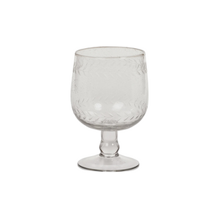 Nature inspired leaf pattern etched wine glass made of clear glass.