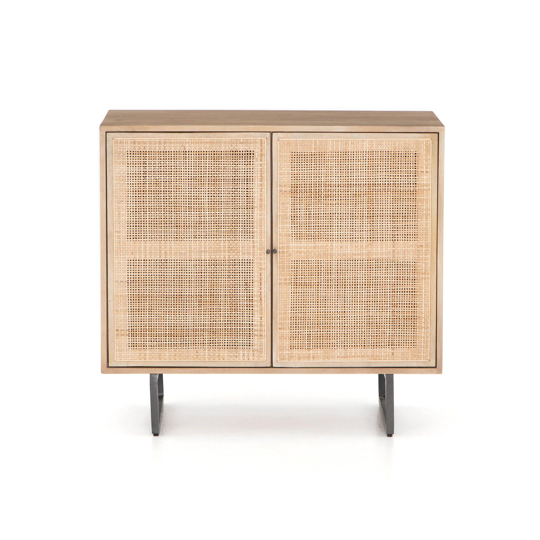 Surrounded by mango casing, light cane weaves for a fresh look with natural depth. Angular gunmetal-finished iron legs offer an intriguing contrast of texture and tone.