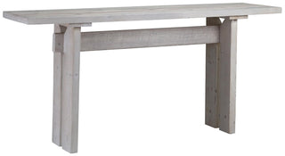 Sofa table made of reclaimed pine wood in a warm wash finish.