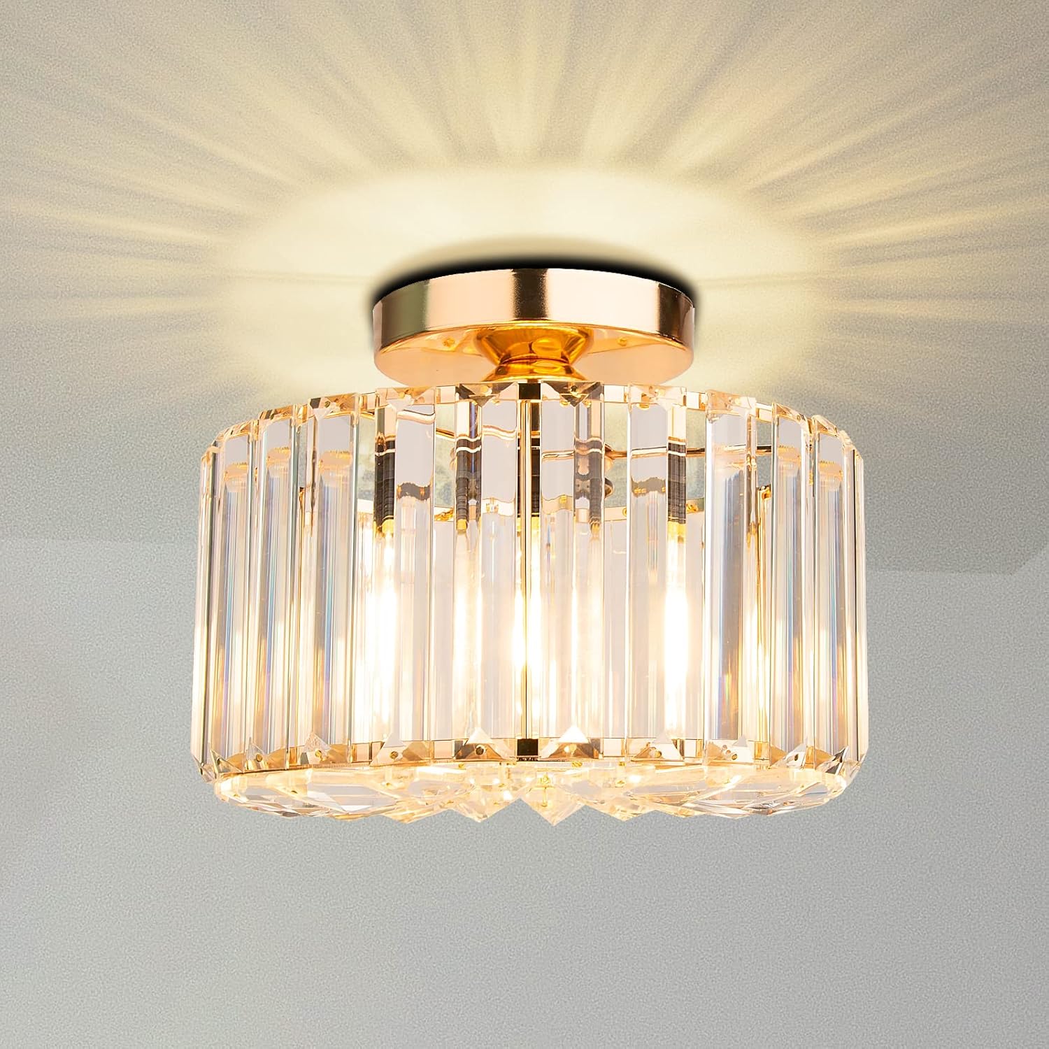 Golden ceiling mount and gold chain to hold pendant lighting.