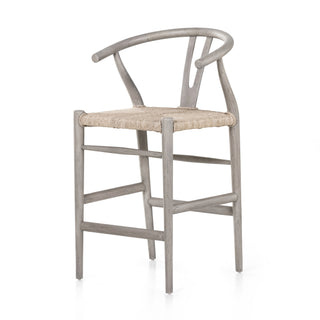 Modern curves redefine the classic wishbone-style counter stool. Vintage white all-weather wicker is woven for a dose of fresh texture within weathered grey teak framing. Cover or store indoors during inclement weather and when not in use. 38.5"H.  Overall Dimensions: 21.75"w x 22.50"d x 38.50"h  Local Pick Up or Local Delivery Only. Please call 480-733-6863 for more information.