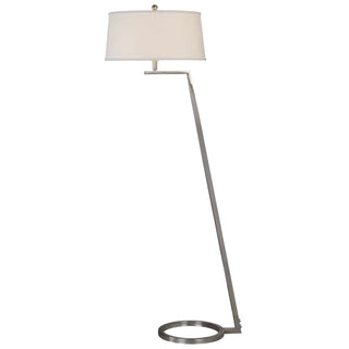 Steel open ring foot balancing a slightly tapered arm finished in a plated brushed nickel. The tapered round hardback shade is a white linen fabric.