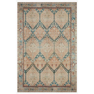 Patterned rug in with rust, blue and tan colors.