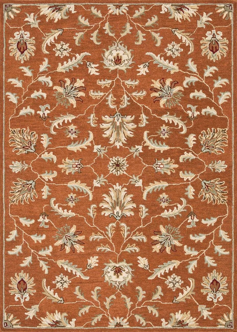 Patterned rug in with rust, blue and tan colors.