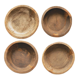 Four round decorative Teakwood bowls.